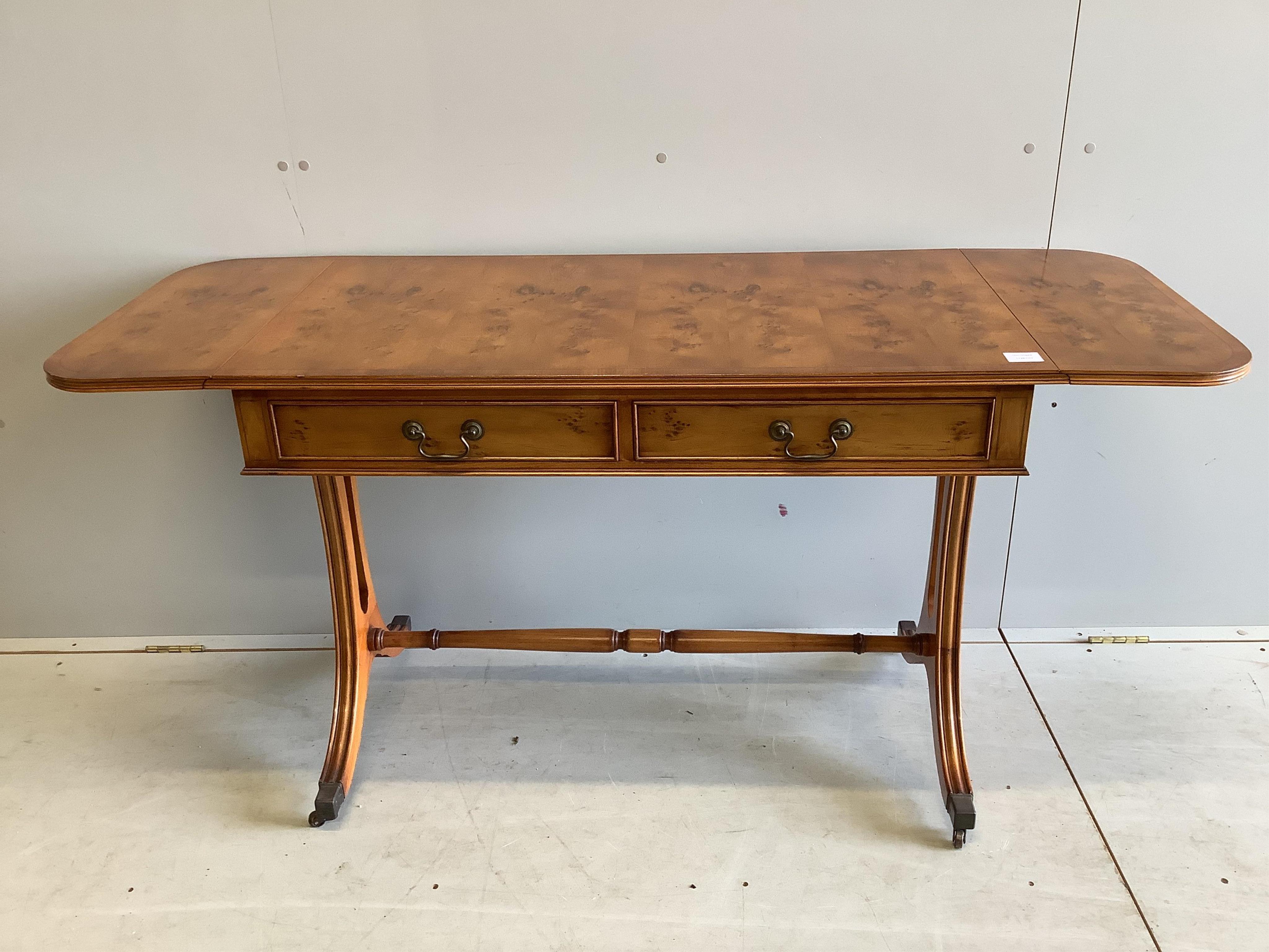 A reproduction Regency style yew sofa table, width 104cm, depth 56cm, height 74cm. Condition - good